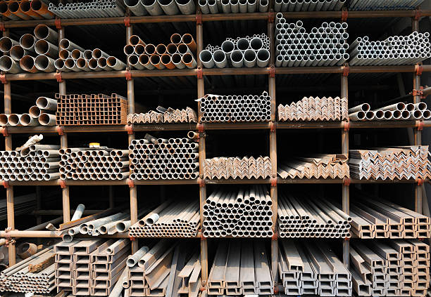 Different sizes of metal pipes on shelf